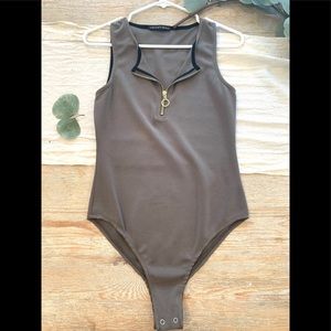 Olive green body suit with gold zipper